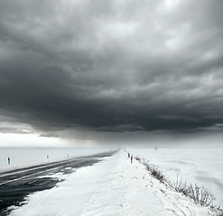 Image showing Stormy sky and snow road