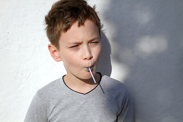 Image showing Boy with blue lollipop