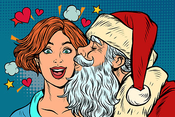 Image showing Santa Claus kisses a woman, Christmas and New year