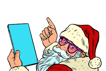 Image showing Santa Claus with a tablet. New year and Christmas online sales concept