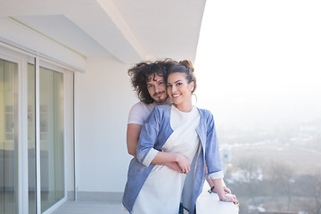 Image showing Couple hugging on the balcony