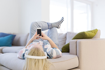 Image showing girl enjoying music through headphones