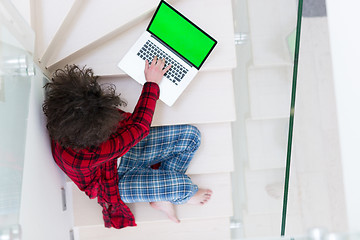 Image showing freelancer in bathrobe working from home