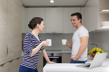 Image showing couple with laptop computer enjoying morning