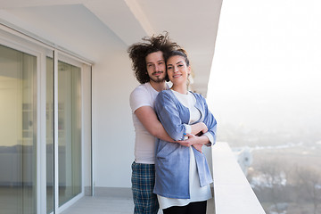 Image showing Couple hugging on the balcony