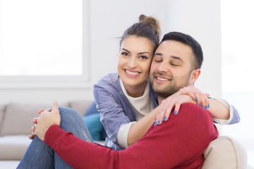 Image showing couple hugging and relaxing on sofa