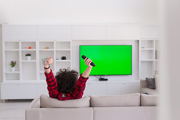 Image showing young man in bathrobe enjoying free time