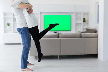 Image showing couple hugging in their new home