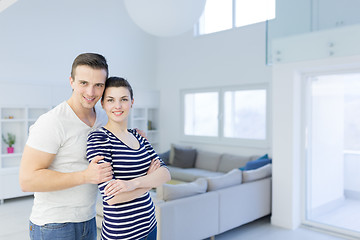 Image showing couple hugging in their new home