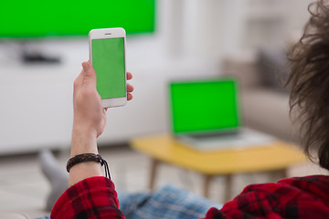 Image showing young man in bathrobe enjoying free time