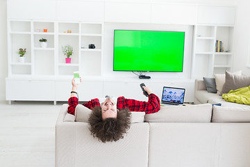 Image showing young man in bathrobe enjoying free time