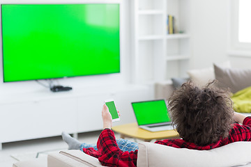 Image showing young man in bathrobe enjoying free time