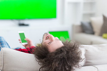 Image showing young man in bathrobe enjoying free time