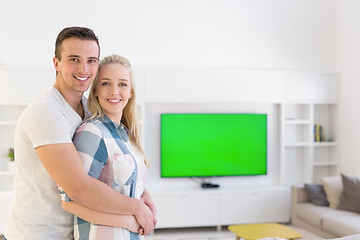 Image showing couple hugging in their new home