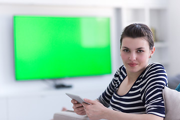 Image showing woman on sofa using tablet computer