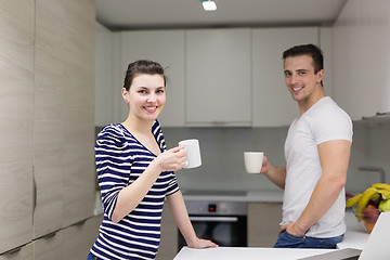 Image showing couple with laptop computer enjoying morning