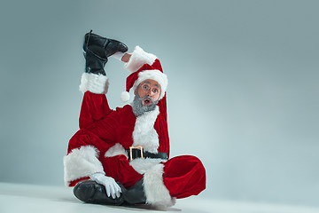 Image showing Funny guy in christmas hat. New Year Holiday. Christmas, x-mas, winter, gifts concept.