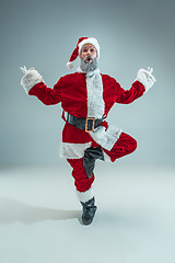 Image showing Funny guy in christmas hat. New Year Holiday. Christmas, x-mas, winter, gifts concept.