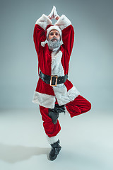 Image showing Funny guy in christmas hat. New Year Holiday. Christmas, x-mas, winter, gifts concept.