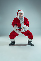 Image showing Funny guy in christmas hat. New Year Holiday. Christmas, x-mas, winter, gifts concept.