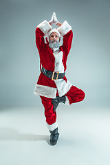 Image showing Funny guy in christmas hat. New Year Holiday. Christmas, x-mas, winter, gifts concept.