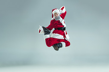 Image showing Funny guy in christmas hat. New Year Holiday. Christmas, x-mas, winter, gifts concept.