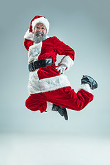 Image showing Funny guy in christmas hat. New Year Holiday. Christmas, x-mas, winter, gifts concept.