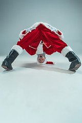 Image showing Funny guy in christmas hat. New Year Holiday. Christmas, x-mas, winter, gifts concept.