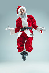 Image showing Funny guy in christmas hat. New Year Holiday. Christmas, x-mas, winter, gifts concept.