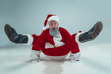 Image showing Funny guy in christmas hat. New Year Holiday. Christmas, x-mas, winter, gifts concept.