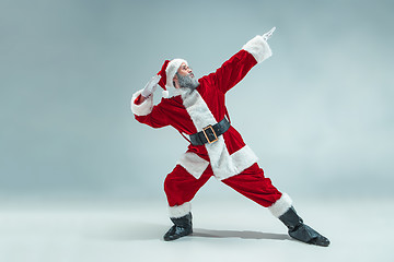 Image showing Funny guy in christmas hat. New Year Holiday. Christmas, x-mas, winter, gifts concept.