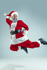 Image showing Funny guy in christmas hat. New Year Holiday. Christmas, x-mas, winter, gifts concept.