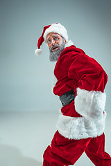 Image showing Funny guy in christmas hat. New Year Holiday. Christmas, x-mas, winter, gifts concept.