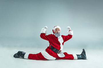 Image showing Funny guy in christmas hat. New Year Holiday. Christmas, x-mas, winter, gifts concept.