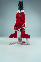 Image showing Funny guy in christmas hat. New Year Holiday. Christmas, x-mas, winter, gifts concept.