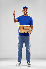 Image showing delivery man with food showing thumbs up