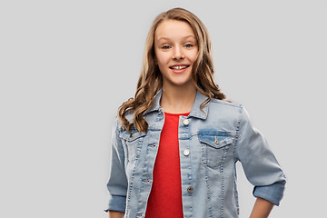 Image showing smiling teenage girl in denim jacket