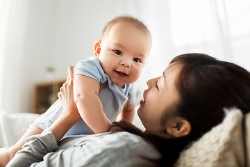 Image showing happy mother with little baby son at home