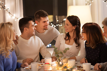 Image showing happy family having tea party at home