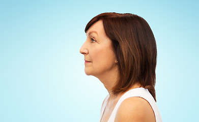 Image showing profile of senior woman over white background