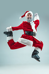 Image showing Funny guy in christmas hat. New Year Holiday. Christmas, x-mas, winter, gifts concept.