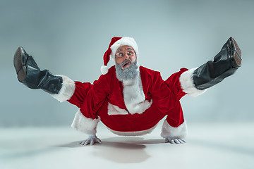 Image showing Funny guy in christmas hat. New Year Holiday. Christmas, x-mas, winter, gifts concept.