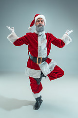 Image showing Funny guy in christmas hat. New Year Holiday. Christmas, x-mas, winter, gifts concept.