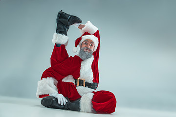 Image showing Funny guy in christmas hat. New Year Holiday. Christmas, x-mas, winter, gifts concept.