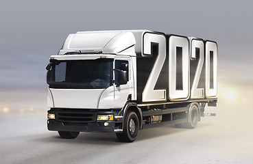 Image showing truck delivers 2020 by new year in winter