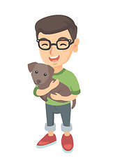 Image showing Caucasian happy boy in glasses holding a dog.