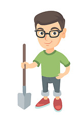 Image showing Caucasian smiling boy in glasses holding a shovel.