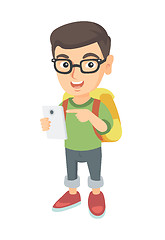 Image showing Caucasian boy with backpack pointing at cellphone.
