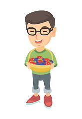 Image showing Boy with the basket of strawberry and blueberry.