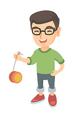 Image showing Caucasian boy in glasses playing with yo-yo.